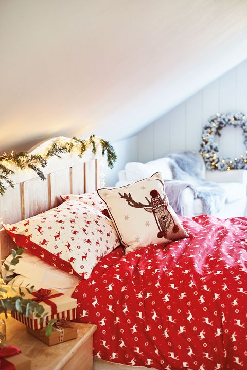christmas bedroom with bright red bedlinen