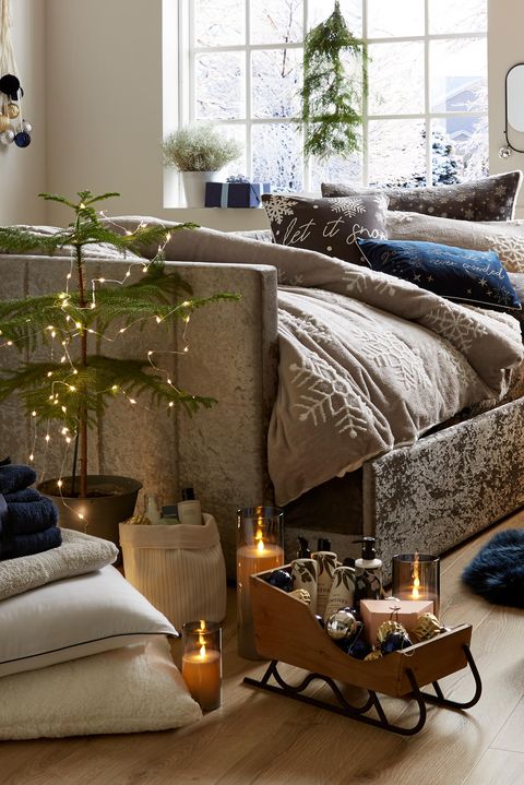 christmas bedroom with christmas tree and twinkling lights