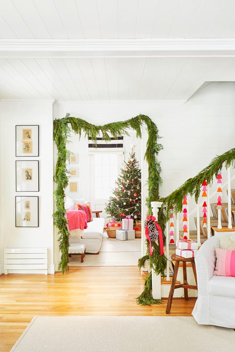 white and pink hallway decorated for christmas