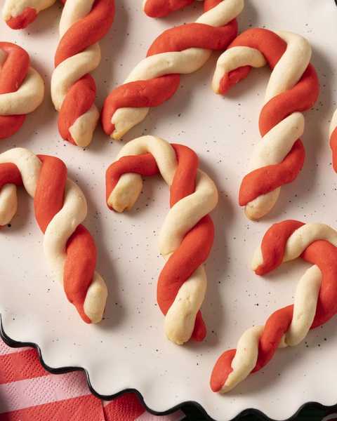candy cane cookies on white plate