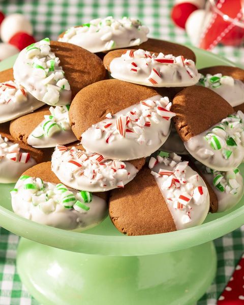 chocolate candy cane cookies on green cake stand