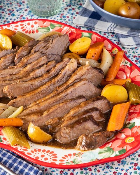slow cooker brisket with veggies on floral plate