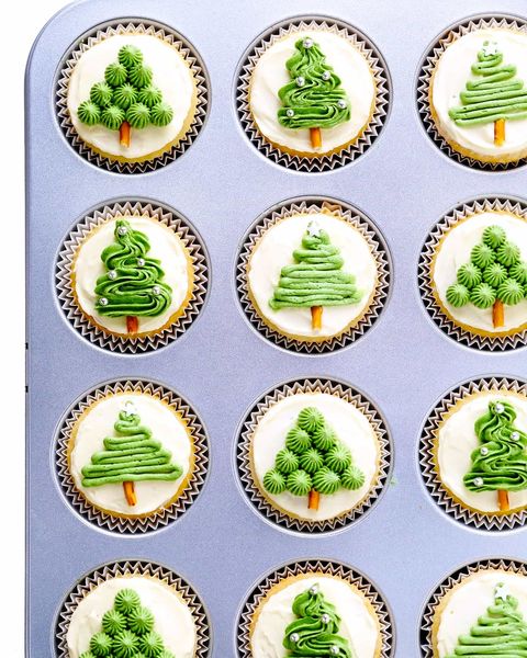christmas tree cupcakes in muffin tin with different green trees