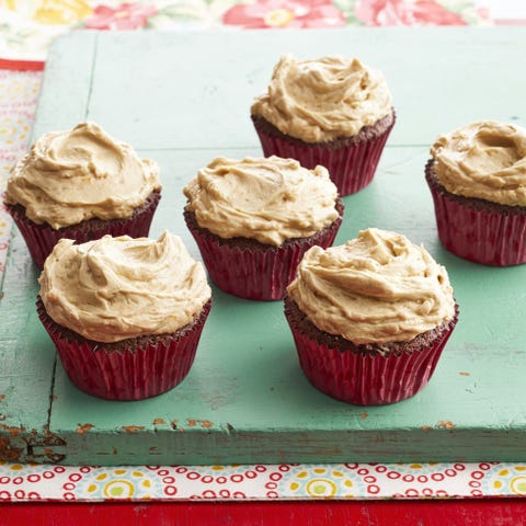 dr pepper cupcakes in red liners on green board