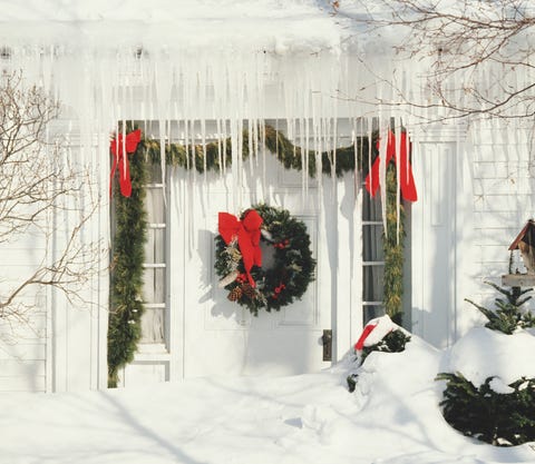 christmas decorations and icicles by front door of house