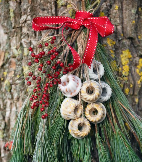 christmas tree branches with homemade mini peanuts bundt cakes hanging in garden