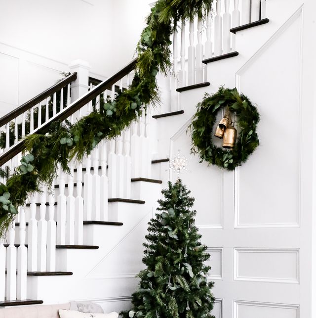 how to hang garland, domestically blissful stairwell with garland and small christmas tree