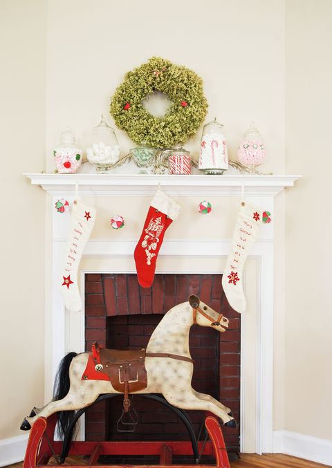 christmas fireplace display with rocking horse