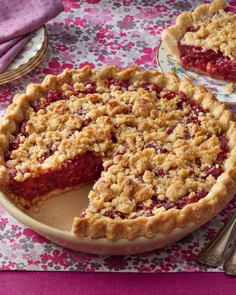 cherry crumb pie on pink surface