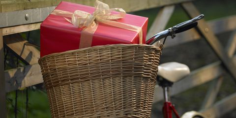 Christmas present in basket on bike.