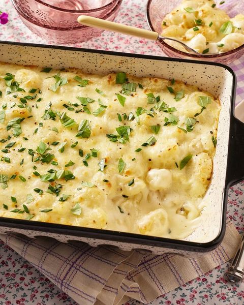 baked gnocchi alfredo in black and white dish