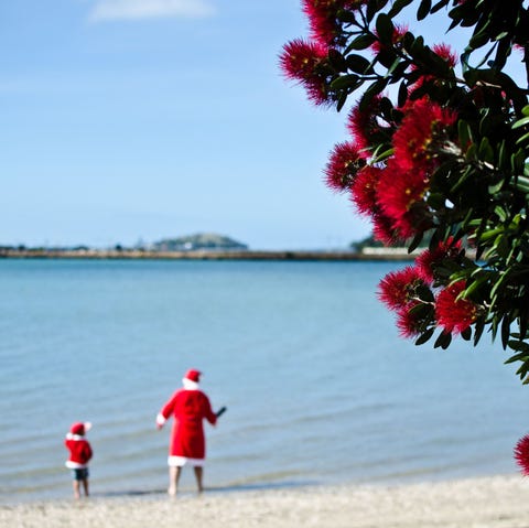santa and child on beach santa and child on beach