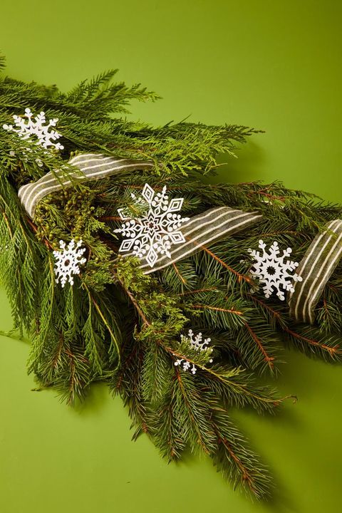 snowflake diy christmas ornaments on greenery