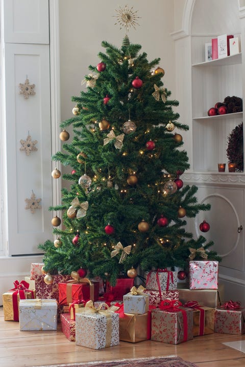 christmas facts christmas tree surrounded with gifts