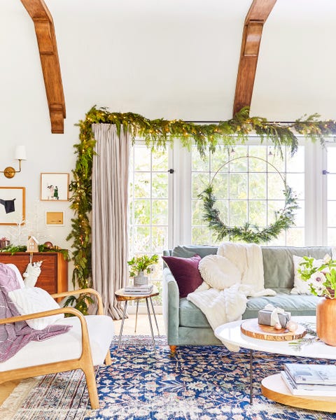 living room with windows decorated for the holidays