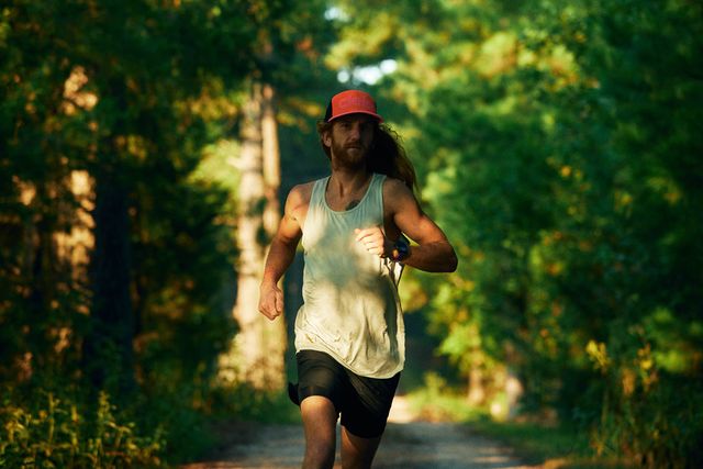 man running wearing ciele athletics hat