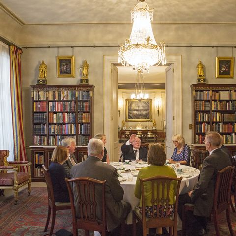 the prince of wales, patron, the battle of britain fighter association, and the duchess of cornwall host a tea for veterans, widows and members of the battle of britain fighter association, clarence house, londonhere, squadron leader dick summers entertains the table and the duchess 06 september 2016picture by jack hill