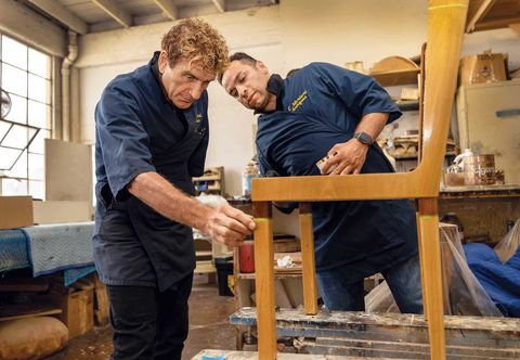 artisan claudio mariani, left, and his colleague jose umansor restore a chair at c mariani antiques in san francisco