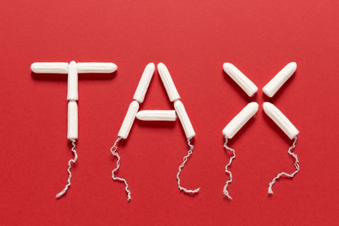Clean Tampons Forming the Word TAX on a Red Background