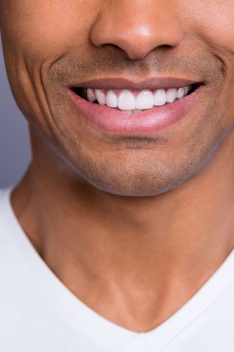 close up cropped portrait of nice handsome attractive cheerful cheery well groomed guy wearing white shirt beaming shine teeth isolated over gray violet purple pastel background
