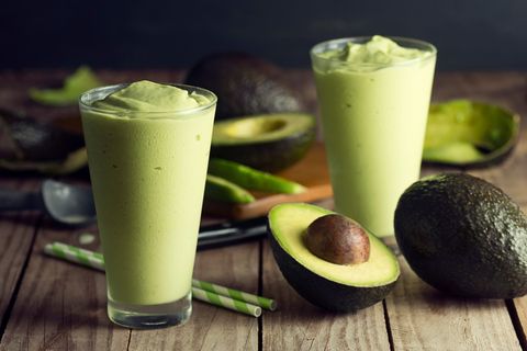 Close-Up Of Avocado Smoothie In Glasses On Table
