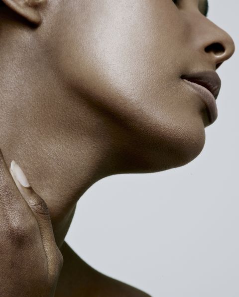 close up of black females neck and chin