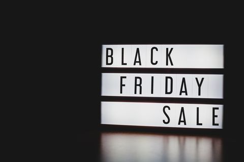 close up of black friday sale text on information sign against black background