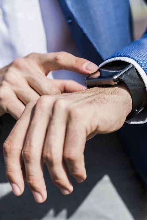 Close-up of businessman with smartwatch