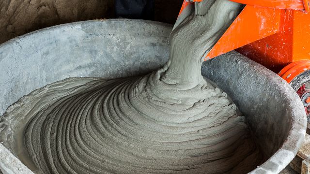 close up of cement being poured in container