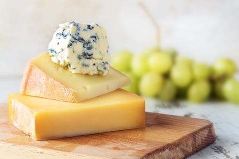 Close-Up Of Cheese On Cutting Board At Table smelly farts