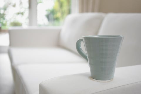 Close up of coffee cup on sofa