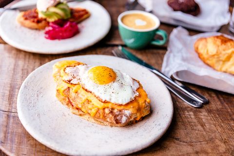 close up of croque madame with fried sunny side up egg on the table