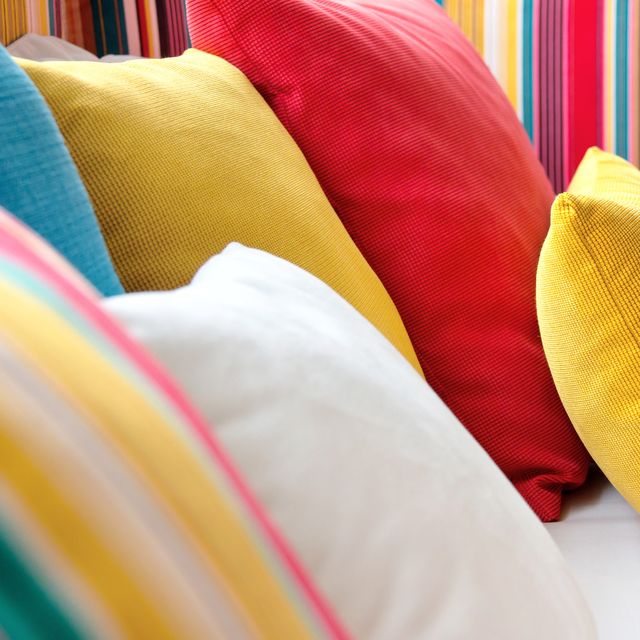 Close-Up Of Cushions On Sofa At Home