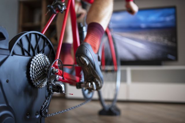 close up of cyclist exercising at home