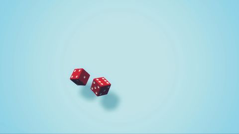 Close-Up Of Dices On Blue Background