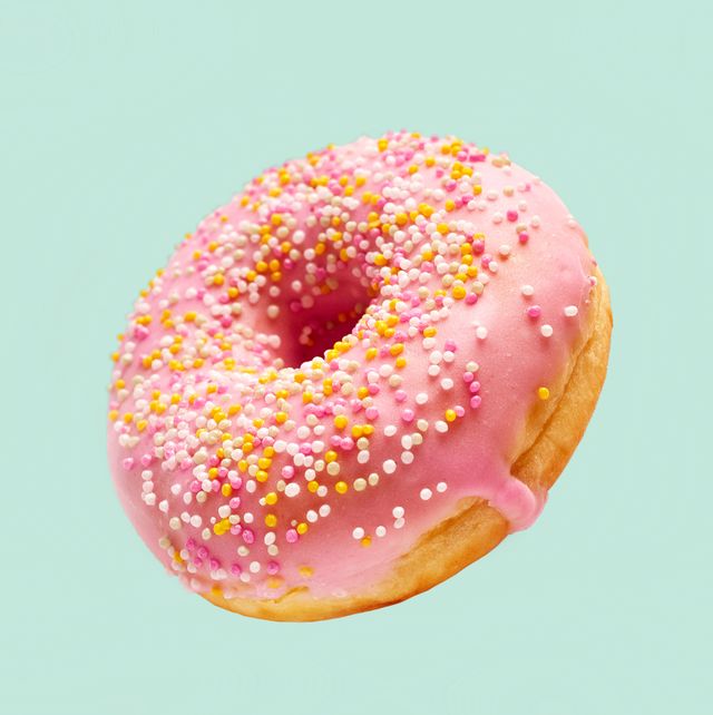 close up of donut against blue background
