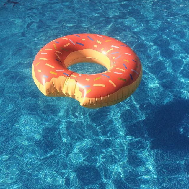 close up of donut shaped inflatable ring on swimming pool