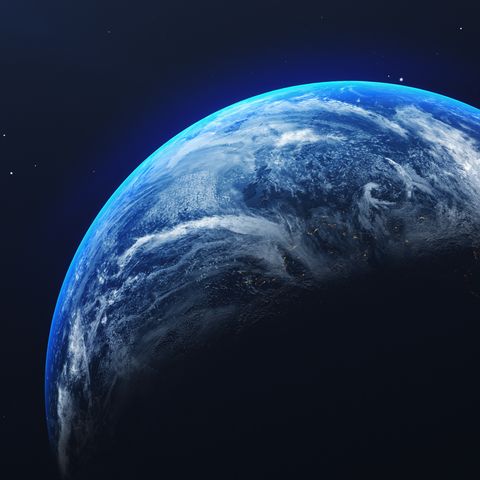 alien and space theories close up of earth against blue sky at night