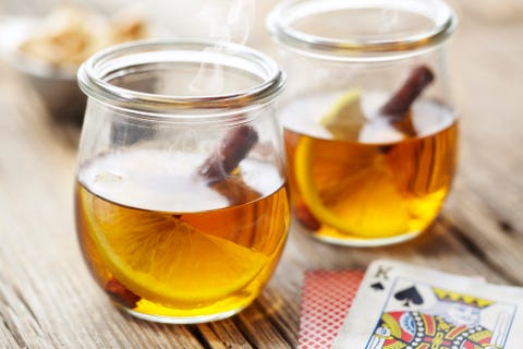 Close-up of hot toddy served in glass mugs on table