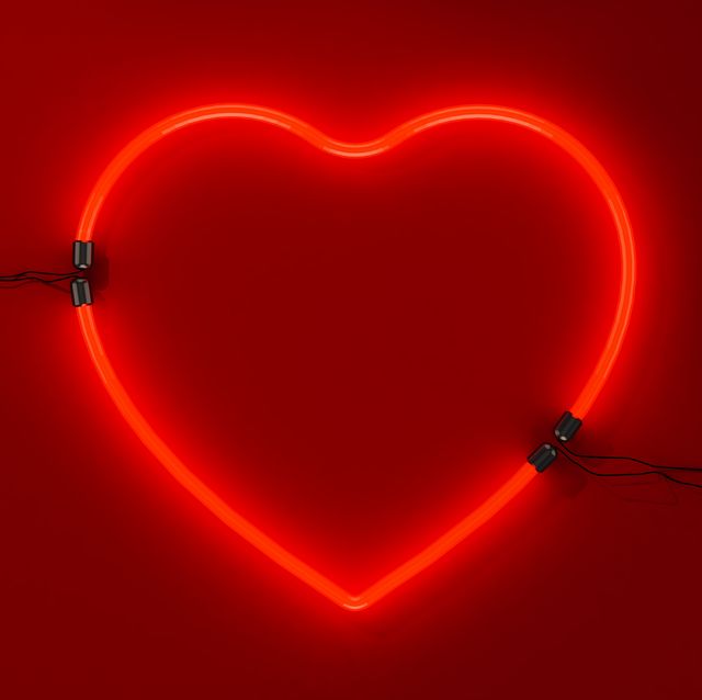 close up of illuminated heart shape against black background