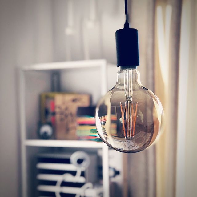 close up of light bulb hanging at home