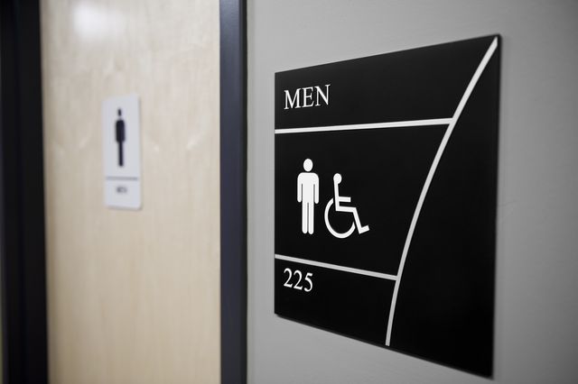 close up of men's restroom sign