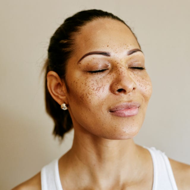 Close up of mixed race woman with eyes closed