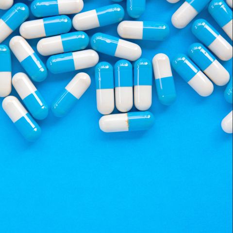 Close-Up Of Multi Colored Pills On Table