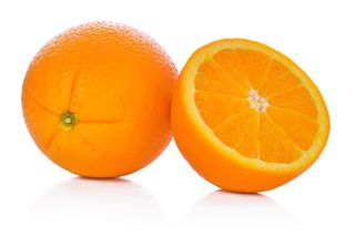 Close-Up Of Orange Fruit Against White Background
