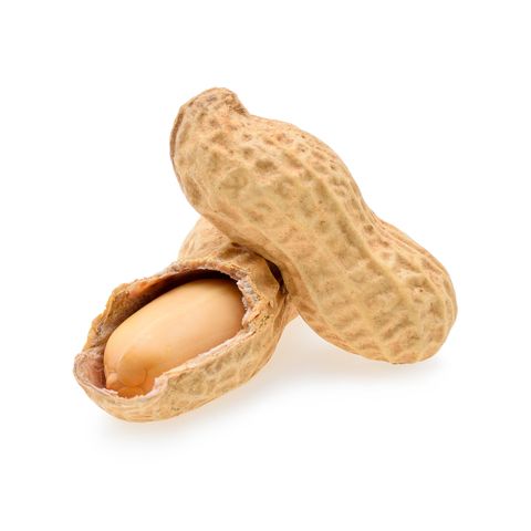 close up of peanuts against white background