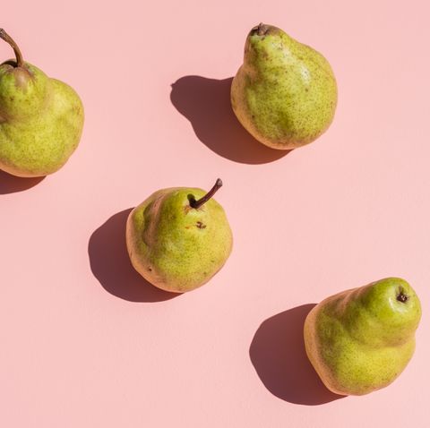 Close-Up Of Pears Over Peach Background