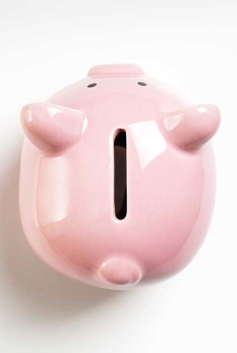 new years resolutions - Close-Up Of Piggy Bank On White Background