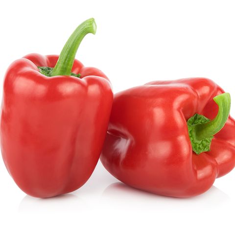 Close-Up Of Red Bell Peppers Over White Background