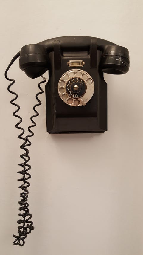 Close-Up Of Telephone On Wall